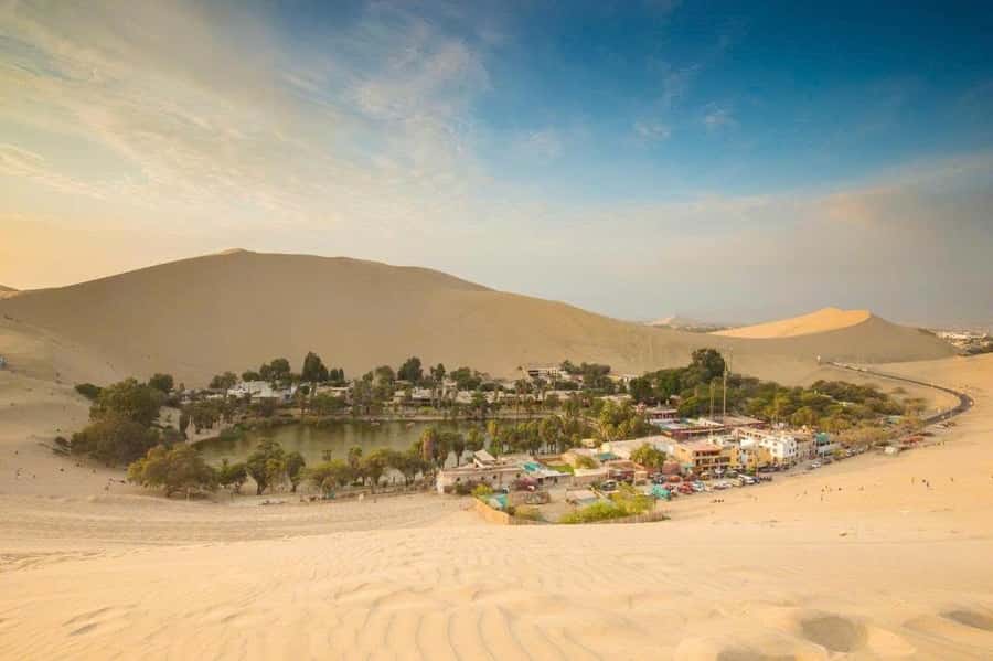 From Lima: Paracas and Huacachina Oasis Full Day Guided Tour - Huacachina Oasis at Sunset: Buggy Up, Sandboard Down