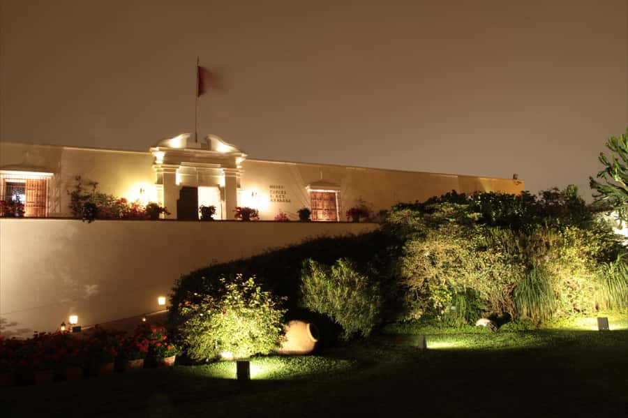 Lima: Huaca Ruins and Larco Museum at Night with Dinner - Larco Museum at night: pre-Inca art with standout objects