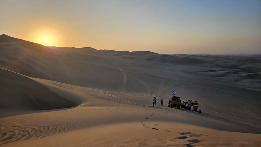 Lima: Paracas & Huacachina Oasis Day Trip with Wine & Dunes - Huacachina Oasis stroll: photos first, then the desert shift